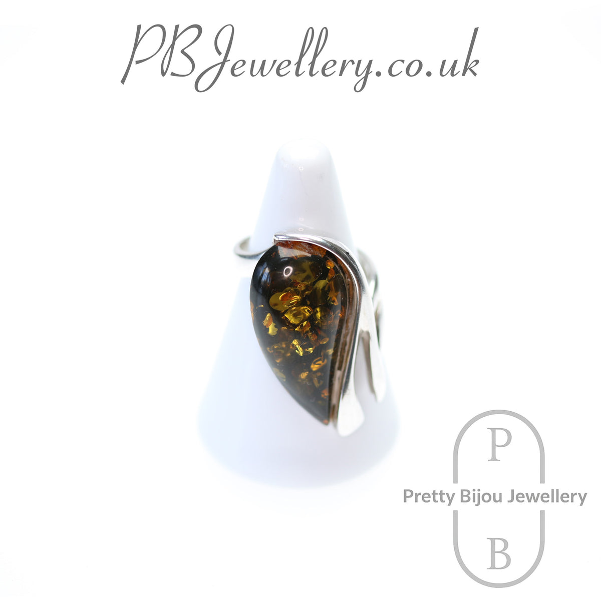 Teardrop amber sterling silver ring with flower setting, size Q – view 1