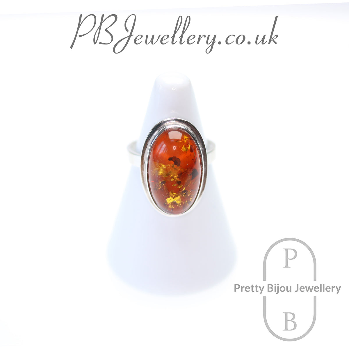 Oval amber cabochon sterling silver ring, size P – view 1